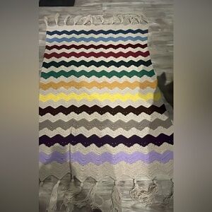 Multicolored afghan with tassels